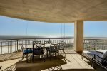Balcony offers plenty of seating for all to enjoy the sand, surf and waves. 